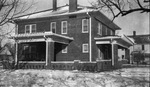 A large two story house after a snow storm by Basil Clemons 1887-1964