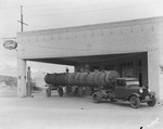 A transport truck at a gas station by Basil Clemons 1887-1964