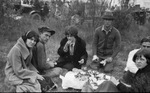 A family picnicking outside by Basil Clemons 1887-1964