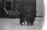 A family playing in the snow by Basil Clemons 1887-1964