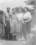 A family standing outside by Basil Clemons 1887-1964