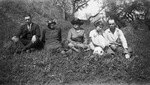 A family sitting outside by Basil Clemons 1887-1964