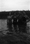 A family standing in water by Basil Clemons 1887-1964