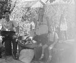 A family outside by Basil Clemons 1887-1964