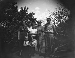 A family standing outside by Basil Clemons 1887-1964