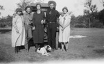 A family and their dog by Basil Clemons 1887-1964