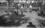 A family and chickens by Basil Clemons 1887-1964