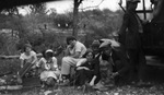 A family sitting outside by Basil Clemons 1887-1964