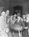 A family with a turkey by Basil Clemons 1887-1964