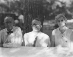 A family sitting at a table by Basil Clemons 1887-1964