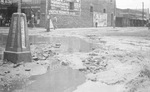 A muddy street by Basil Clemons 1887-1964