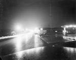 A car in a parking lot by Basil Clemons 1887-1964