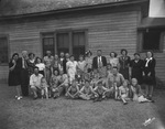 Members of a family pose for an outdoors photograph by Basil Clemons 1887-1964