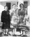 Three women stand in front of a house by Basil Clemons 1887-1964