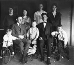 A family indoors photograph by Basil Clemons 1887-1964