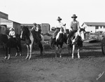 A man, woman, and three children riding horses by Basil Clemons 1887-1964