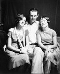 Two young women and one young man posing for a picture by Basil Clemons 1887-1964