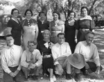 A family poses for an outdoor photograph by Basil Clemons 1887-1964