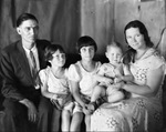 A young couple with two young daughters and a baby boy by Basil Clemons 1887-1964