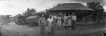 A family in front of a house by Basil Clemons 1887-1964