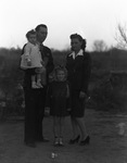 A young couple and two small children by Basil Clemons 1887-1964