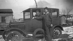 A couple in a car by Basil Clemons 1887-1964