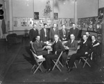 A group of Rotary International members around a conference table by Basil Clemons 1887-1964