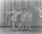 Three young costumed female Davis Dancers performers on a stage by Basil Clemons 1887-1964