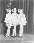 Three young female Davis Dancers performers on a stage by Basil Clemons 1887-1964