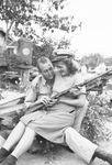 A soldier holding a woman and a gun by Basil Clemons 1887-1964