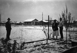 A family out in the snow by Basil Clemons 1887-1964