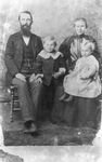 A family posed for a formal portrait by Basil Clemons 1887-1964