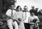 A husband and wife with their son and daughter by Basil Clemons 1887-1964