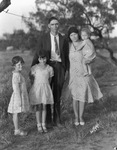 A mother and father with three children by Basil Clemons 1887-1964