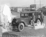 A sedan car parked on a city street; "a finished job by Massey and helpers at Eddy Moore Top & Paint Shop," Breckenridge, Texas by Basil Clemons 1887-1964