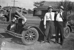 Two men stand beside a car, Breckenridge, Texas by Basil Clemons 1887-1964