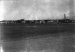 Four propeller-type airplanes parked on the tarmac of an airfield, likely Breckenridge, Texas. by Basil Clemons 1887-1964