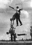 Circus performers in a tight rope walking act by Basil Clemons 1887-1964