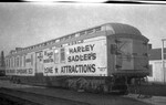 A train car with sign advertising "Harley Sadler's Lone Star Attractions" by Basil Clemons 1887-1964