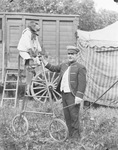 Circus performer with a monkey on a tall bicycle by Basil Clemons 1887-1964