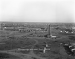 Breckenridge oil field looking north; Texas Pipeline Co. labeled near center of photograph; oil derricks and oil tanks are show on landscape by Basil Clemons 1887-1964