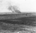 Oil derricks across landscape, photograph labeled as "north east" near Breckenridge, Texas by Basil Clemons 1887-1964