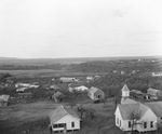 Small scattered settlement of houses and a church near oil fields near Breckenridge, Texas by Basil Clemons 1887-1964