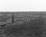 Oil derricks scattered across landscape in oil fields near Breckenridge, Texas by Basil Clemons 1887-1964