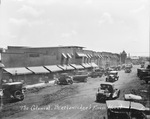 Colonial Hotel, "Breckenridge's Finest Hotel," Breckenridge, Texas, with dirt streets and many cars by Basil Clemons 1887-1964