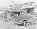 Horse in backseat of Ford car outside Simpson's Grocery, Breckenridge, Texas by Basil Clemons 1887-1964