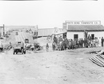 South Bend Townsite Co., Leader Store, Garage, Meat Market, Boiler Works; small community of businesses along a dirt road in South Bend, Texass by Basil Clemons 1887-1964