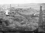 Small settlement and road near oil derricks by Basil Clemons 1887-1964