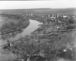 Oil fields near Breckenridge, Texas; air view of the South Bend settlement and a river; settlement includes small buildings and some tents by Basil Clemons 1887-1964