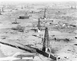 Air view of oil field, derricks, and oil tanks near Breckenridge, Texas by Basil Clemons 1887-1964